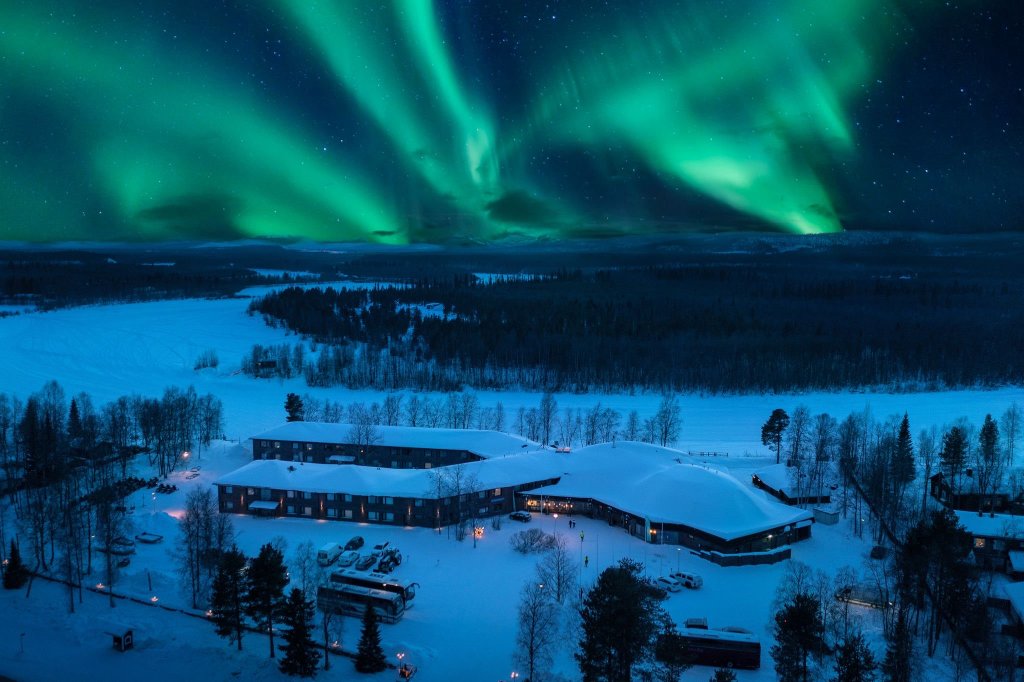 Aerial image of Hotel Ivalo. In the sky above Northen Lights.